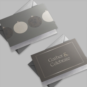 two holiday cards with envelopes