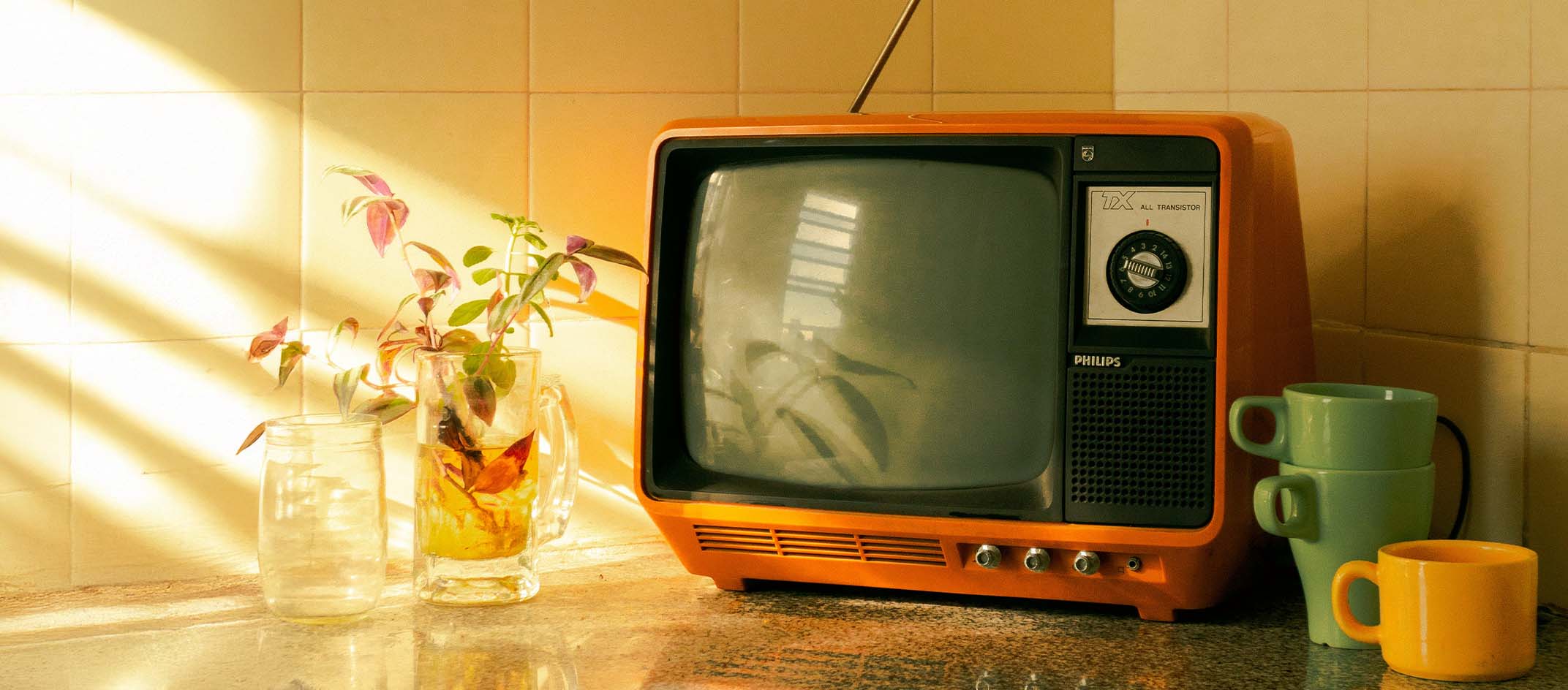 vintage orange tv on counter